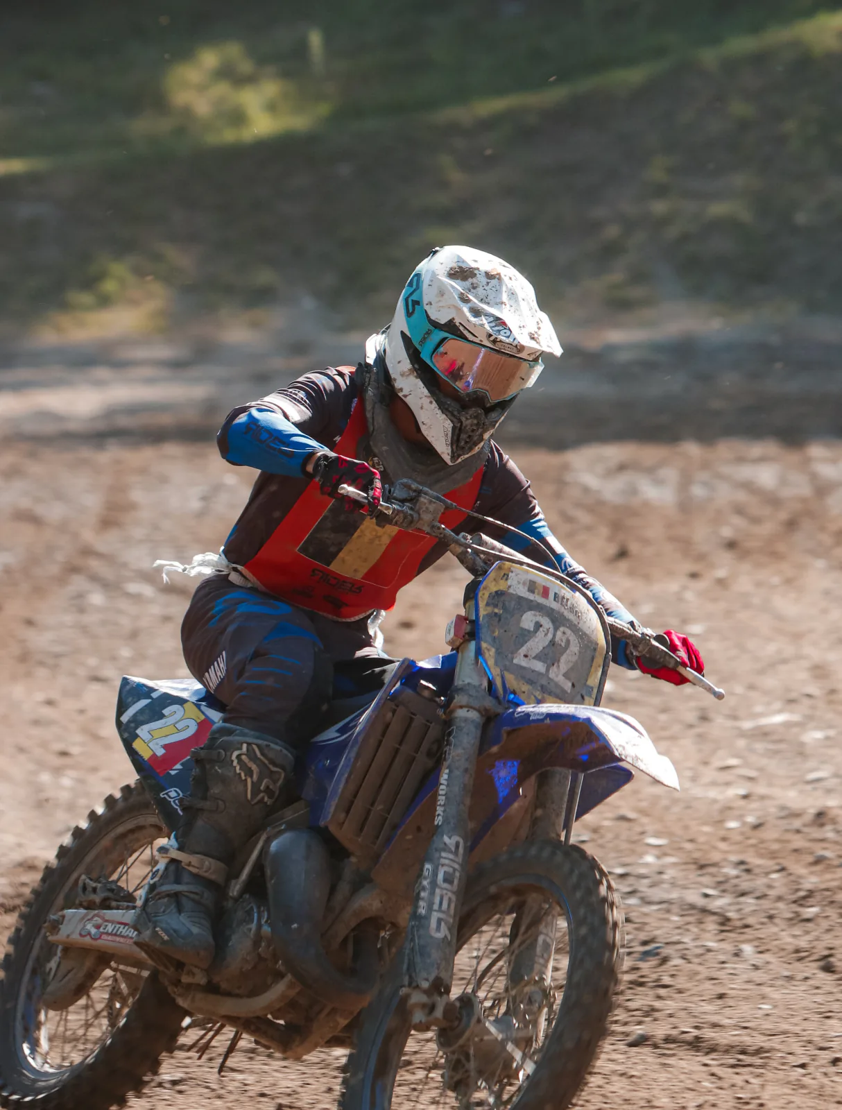 Young rider on a Yamaha number 27 accelerating.